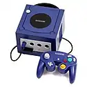 Purple video game console and controller