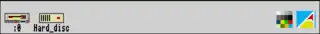 Screenshot of the icon bar under RISC OS 2 showing the following: Left portion, from left – Discs (in this case a floppy disc and hard disc), Right portion, from right – Task Manager, Display Manager